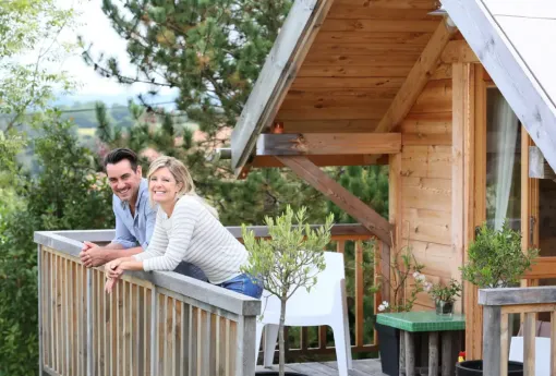 Couple outside cabin