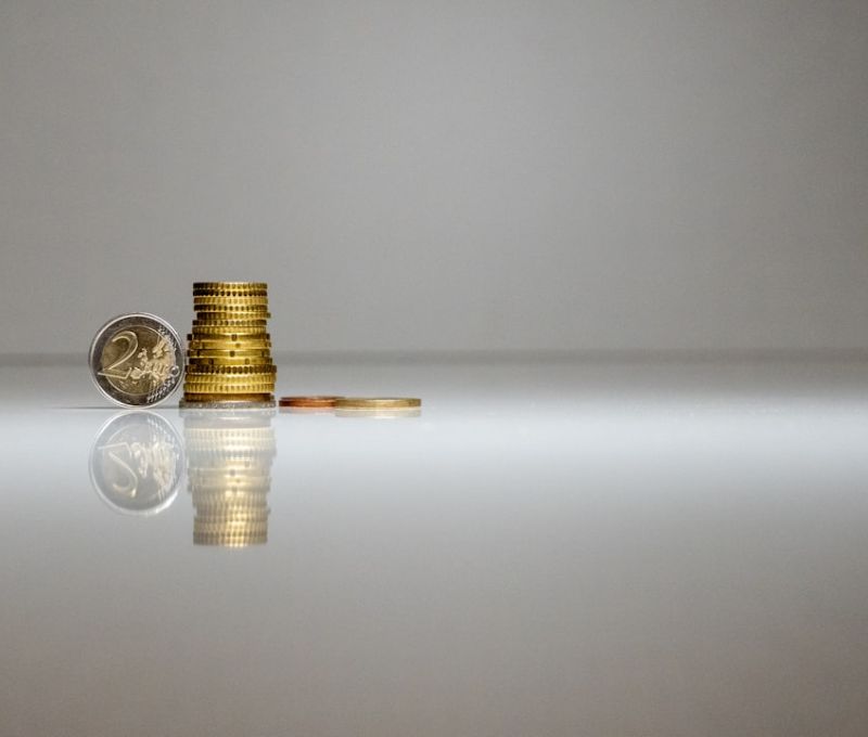 Coins on a reflective background
